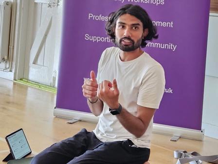 Ankit Kumar teaching at a yoga workshop